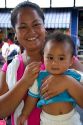 Tahitian woman and child at a market in Papeete on the island of Tahiti.