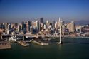 Aerial view of the city of San Francisco, California with the Bay Bridge in foreground.
