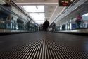 People ride on a moving walkway at the Denver International Airport, Colorado.