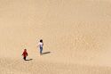 Children play on sand dunes at Nags Head, North Carolina.