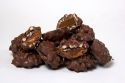 Turtle candies with pecan nuts, caramel and chocolate.