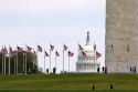 Visitors at the Washington Monument with the dome of the United States Capitol Building in Washington, D.C.