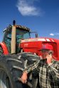 Farmer using a cell phone in the field.