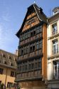 Wooden carved facade on a building at Strasbourg, France near the Cathedral.