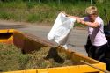 A woman recycling yard waste at Gerardmer, France.