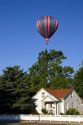 Hot air balloon over houses in Boise, Idaho.