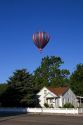 Hot air balloon over houses in Boise, Idaho.