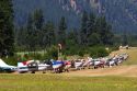 Airstrip with airplanes parked at Garden Valley in the Boise National Forest, Idaho.  Heat waves distort the image.