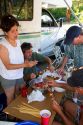 Campers preparing shish kabob meal.