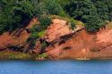 People sea kayaking in the Bay of Fundy at St. Martins, New Brunswick, Canada.