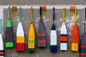 Lobster buoys hang on a wall at a village north of North Rustico on Prince Edward Island, Canada.