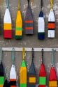 Lobster buoys hang on a wall at a village north of North Rustico on Prince Edward Island, Canada.