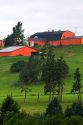 Farm and red barn on a hill at New Glasgow, Prince Edward Island, Canada.