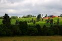 Farm and red barn on a hill at New Glasgow, Prince Edward Island, Canada.