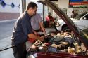 Mechanics giving an automobile an oil change in Boise, Idaho. MR