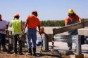 Highway construction crew installing a guardrail and laying concrete on I-80 and I-76 near Big Springs, Nebraska.