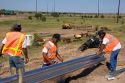 Highway construction crew installing a guardrail on I-80 and I-76 near Big Springs, Nebraska.