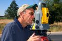 Surveyor using a laser transit in Boise, Idaho.