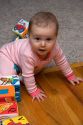 Infant child playing with blocks. MR