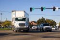 A delivery truck in traffic making a left turn at an intersection in Boise, Idaho.