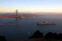 A container ship passes under the Golden Gate Bridge in the San Francisco Bay, California.
