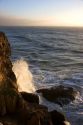 Ocean waves crash into rocks on the California Coast near San Francisco, California.
