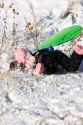 A young girl crashes while sledding on a snow covered hill in Idaho. MR
