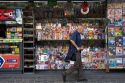 A man walks past a newsstand in the Liberdade asian section of Sao Paulo, Brazil.