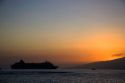 A cruise ship at sunset off the island of Maui, Hawaii.