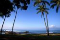 Girl walking with surfboard on the island of Maui, Hawaii.