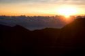 Sunrise above the clouds atop Mount Haleakala on the island of Maui, Hawaii.