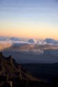 Sunrise above the clouds atop Mount Haleakala on the island of Maui, Hawaii.