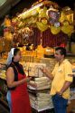 Woman selling cheese and sausages at the Mercado Municipal in Sao Paulo, Brazil.