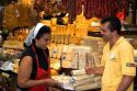 Woman selling cheese and sausage at the Mercado Municipal in Sao Paulo, Brazil.