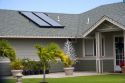 Solar pannels atop the roof of a modern housing developement on the island of Maui, Hawaii.