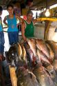 Vendor selling fish at a market in Manaus, Brazil.