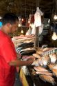 A vendor selling fish at a market in Manaus, Brazil.