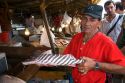 Vendor selling catfish at a market in Manaus, Brazil.