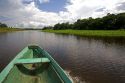 The bow of a dugout canoe on the Arasa River in the Amazon jungle near Manaus, Brazil.