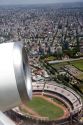 Airplane jet engine and aerial view of Buenos Aires, Argentina.  River soccer stadium at the bottom.