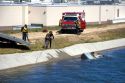 Fire department divers pull a car from a irrigation canal in Boise, Idaho.