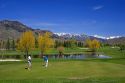 Golfing in Sun Valley, Idaho with Boulder Mountains in the background.