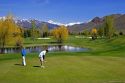 Golfing in Sun Valley, Idaho with Boulder Mountains in the background.
