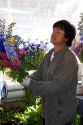 A florist arranging flowers at the Pike Place Market in Seattle, Washington.