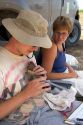 Wildlife biologists conducting research on fledgling burrowing owls near Mountain Home, Idaho.