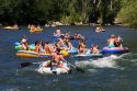 People on inflatable rafts floating the Boise River in Boise, Idaho.