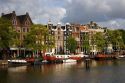 Row houses along the Amstel River in Amsterdam, Netherlands.