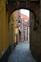 Narrow walking street in Bruges in the province of West Flanders, Belgium.