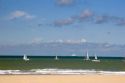 Sailboats in the Strait of Dover in the English Channel at Calais in the department of Pas-de-Calais, France.