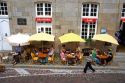 People dine at a sidewalk cafe in Saint-Malo in Brittany, northwestern France.